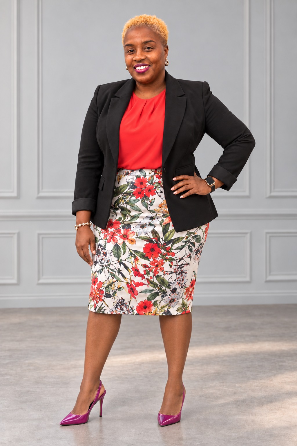 Portrait of Ingrid Marshall in a black blazer, red blouse, floral skirt and pink pumps